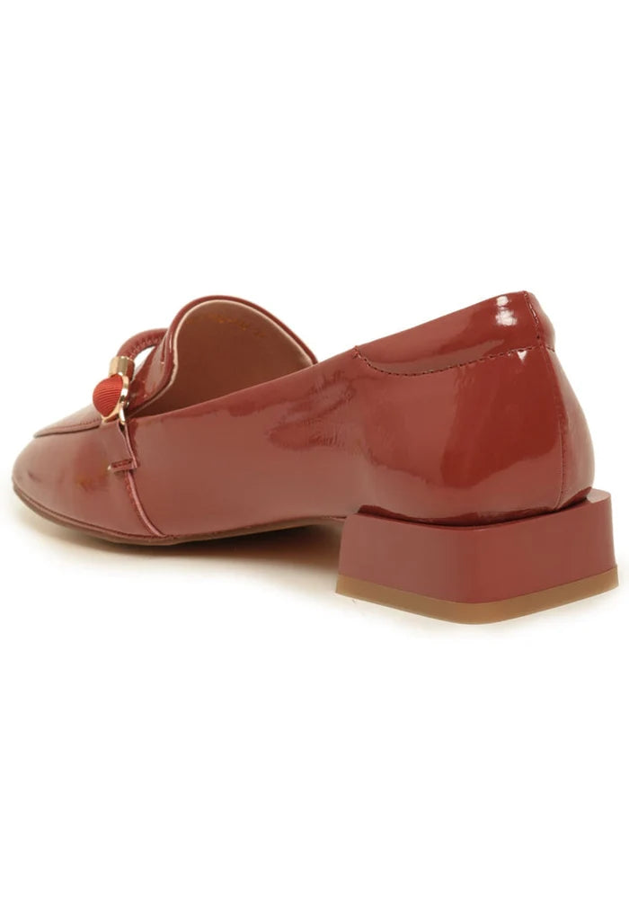 Stylish patent leather loafers with metallic accents in bright orange color - perfect leather slip-on shoes for a trendy look, must-have fashion loafers.