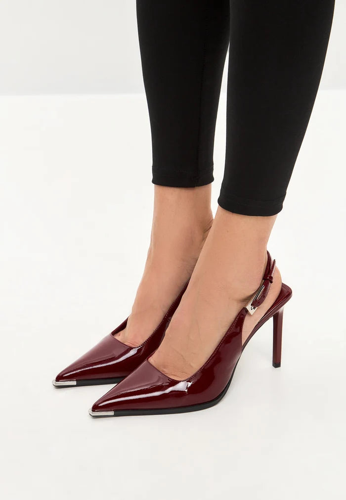 A pair of stylish red patent leather slingback pumps, perfect for women wanting to make a statement with their footwear.