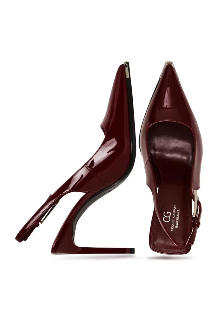 A stylish pair of red patent leather slingback pumps, perfect for a pop of color in any outfit.