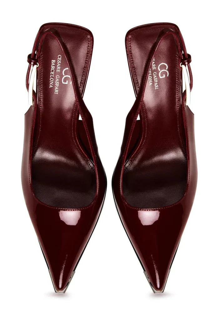 A stylish pair of red patent leather slingback pumps, perfect for any bold fashion statement.