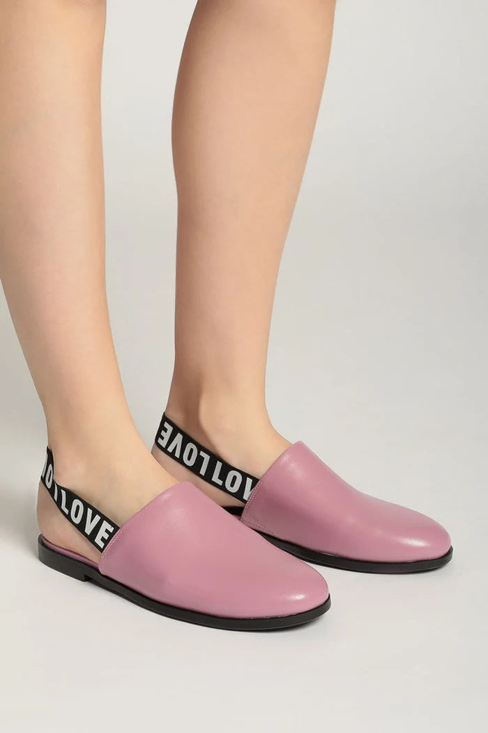 Fashionable pink leather slingback mules with perforated details for women.