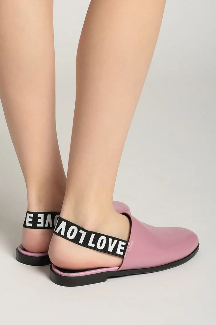 A stylish pair of pink leather slingback mules with perforated detailing for a fashionable look.