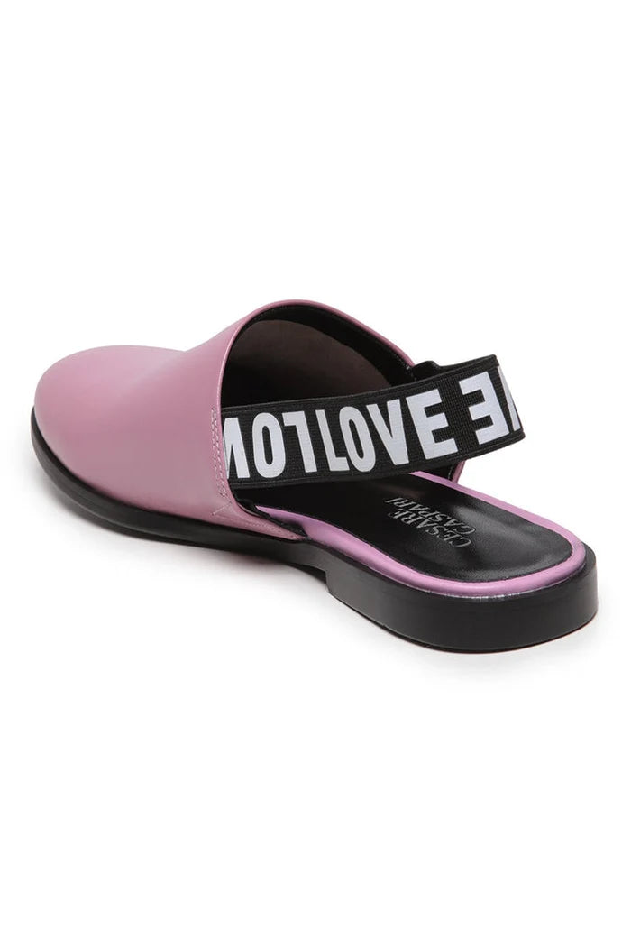 A chic pair of pink leather slingback mules with perforated details, perfect for women who love fashionable footwear.