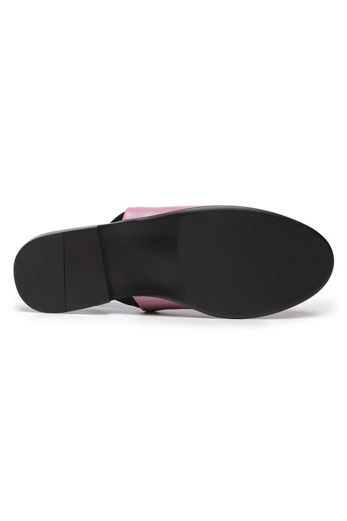 A trendy pair of pink leather slingback mules with perforated details, the perfect fashionable addition to any woman's shoe collection.