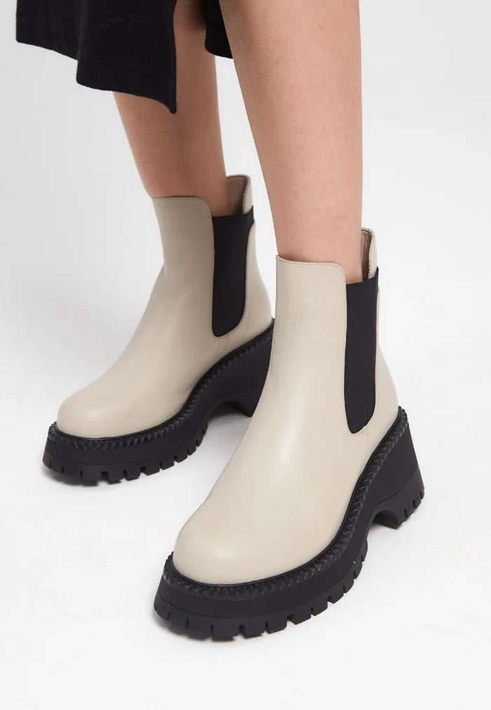 A pair of chunky platform beige Chelsea boots for women, perfect for the latest fashion trends.