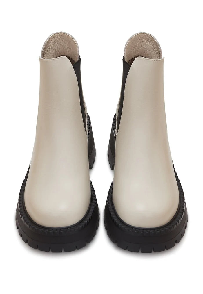 A trendy pair of chunky platform Chelsea boots in beige, perfect for women's fashion.