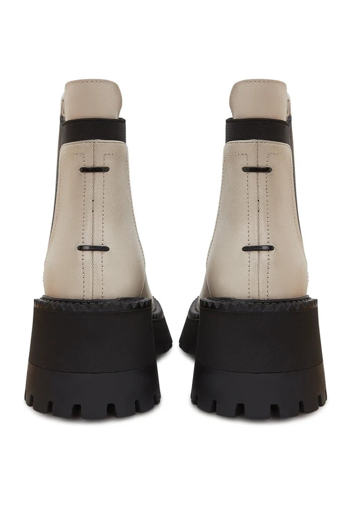 A trendy pair of women's chunky platform Chelsea boots in beige, perfect for elevating your fashion game.