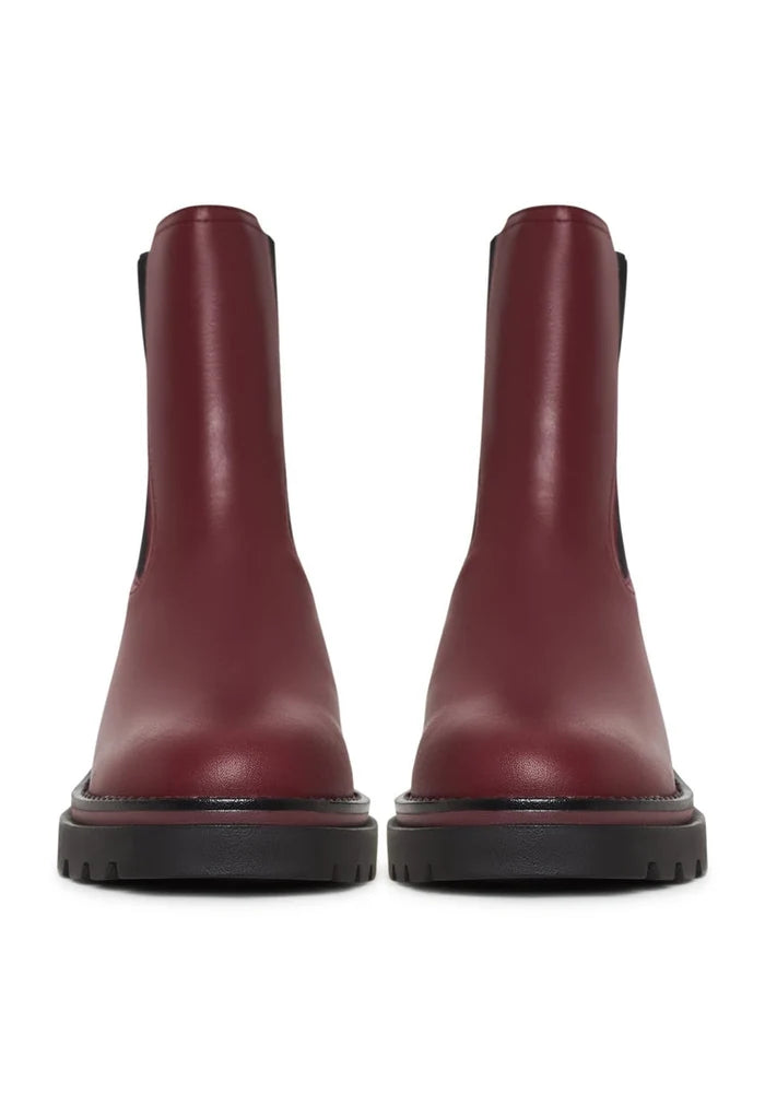 A pair of classic ankle boots in trendy bordeaux color, perfect for fashionable women - designer ankle boots that are a must-have for any wardrobe.