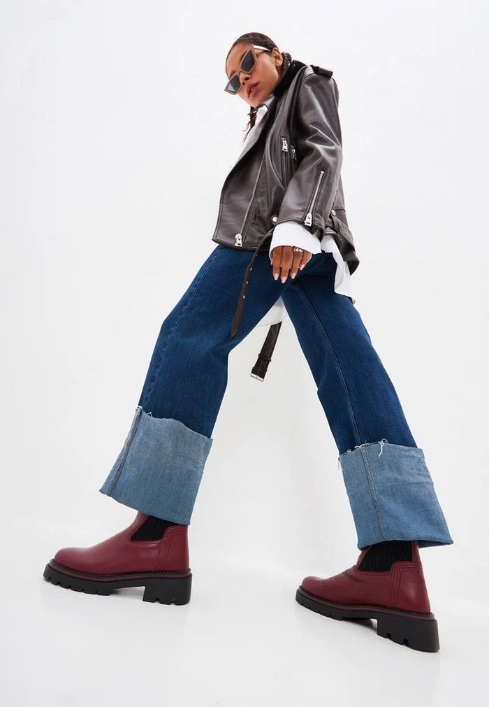 A stylish pair of classic Bordeaux ankle boots for women, perfect for fashion-forward looks by a designer brand.