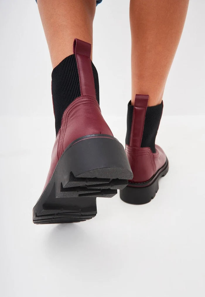 A stylish pair of classic Bordeaux ankle boots for women - perfect for those who love fashion and designer footwear.