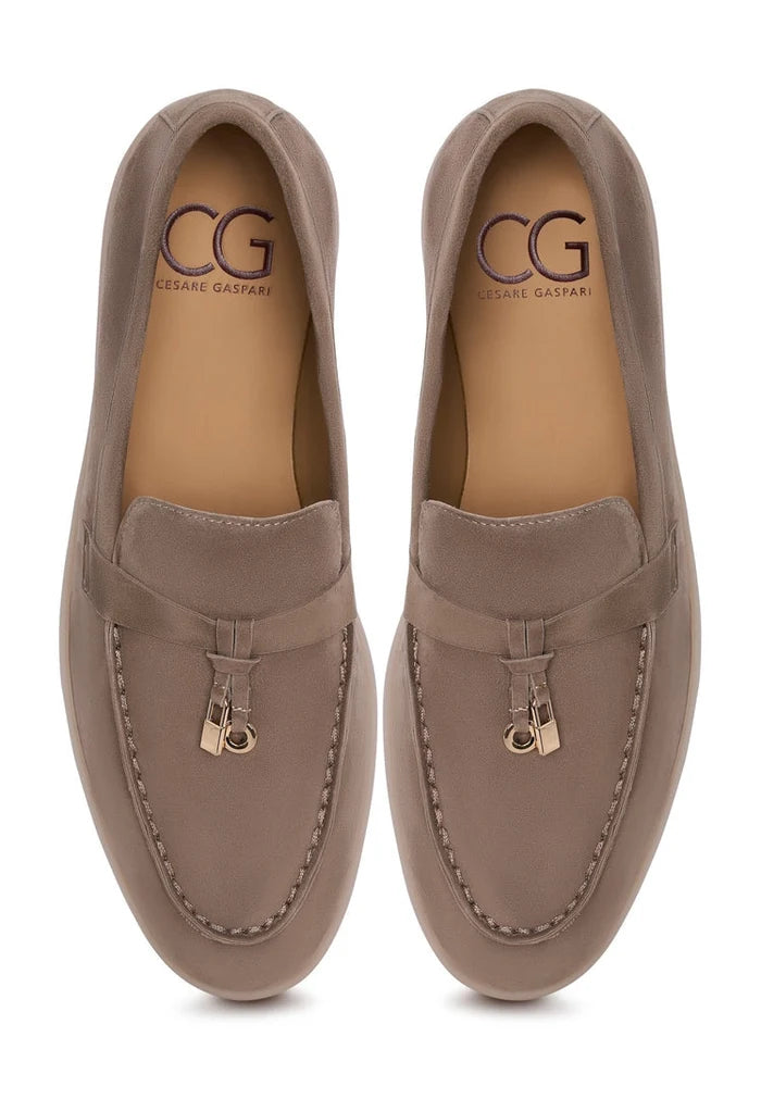A stylish pair of Aurelia platform moccasins in dark beige, perfect for women seeking fashionable comfort and height.