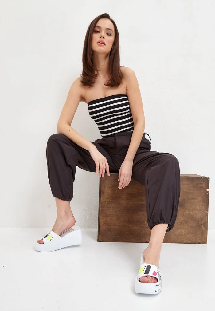 A stylish pair of white platform mule shoes for a chic and trendy look.