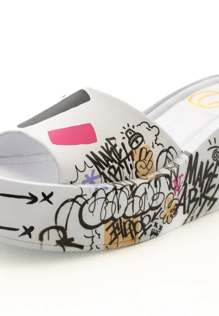 A pair of stylish white platform mule shoes, perfect for adding a touch of sophistication to any outfit.