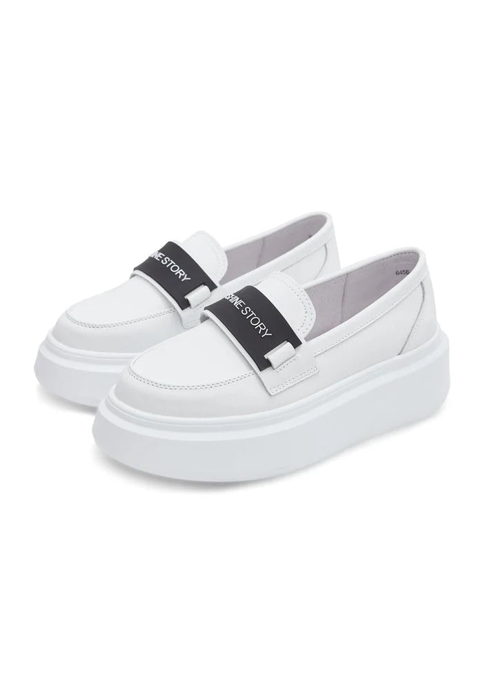 A stylish pair of slip-on platform white loafers, perfect for women's casual footwear.