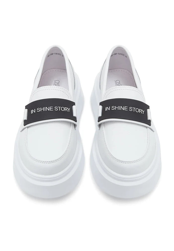 A pair of stylish slip-on platform white loafers, perfect for women's casual footwear.