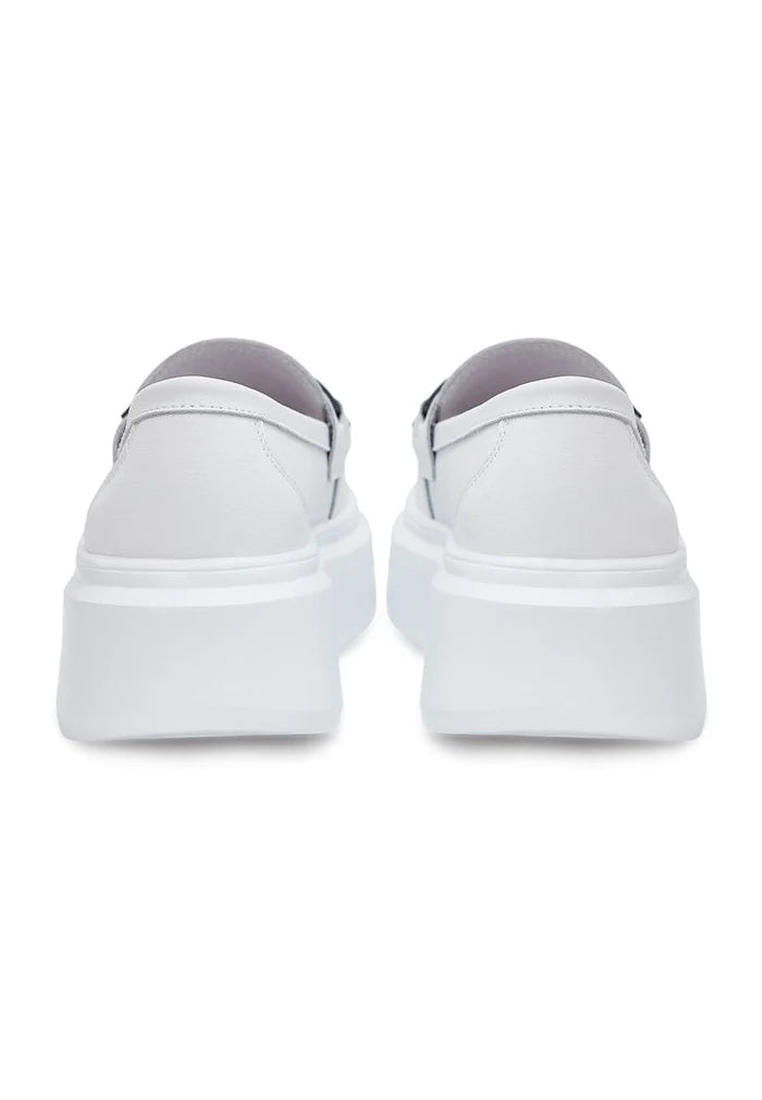 A stylish pair of slip-on white loafers with platform soles, perfect for women's casual footwear.