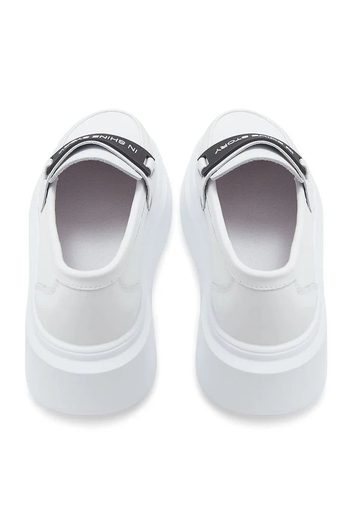 A stylish pair of slip-on platform white loafers for women, perfect for casual footwear.