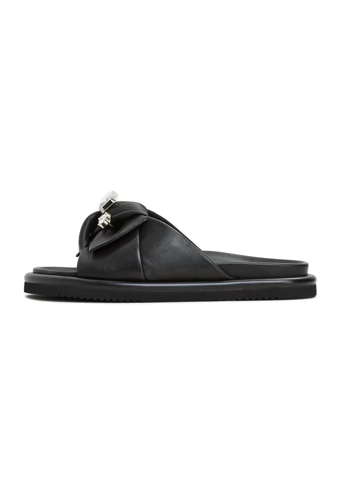 A stylish pair of black platform slippers, known as Fernanda slippers, perfect for women looking for trendy slide sandals or footbed sandals.