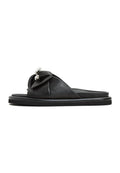 A stylish pair of black platform slippers, known as Fernanda slippers, perfect for women looking for trendy slide sandals or footbed sandals.