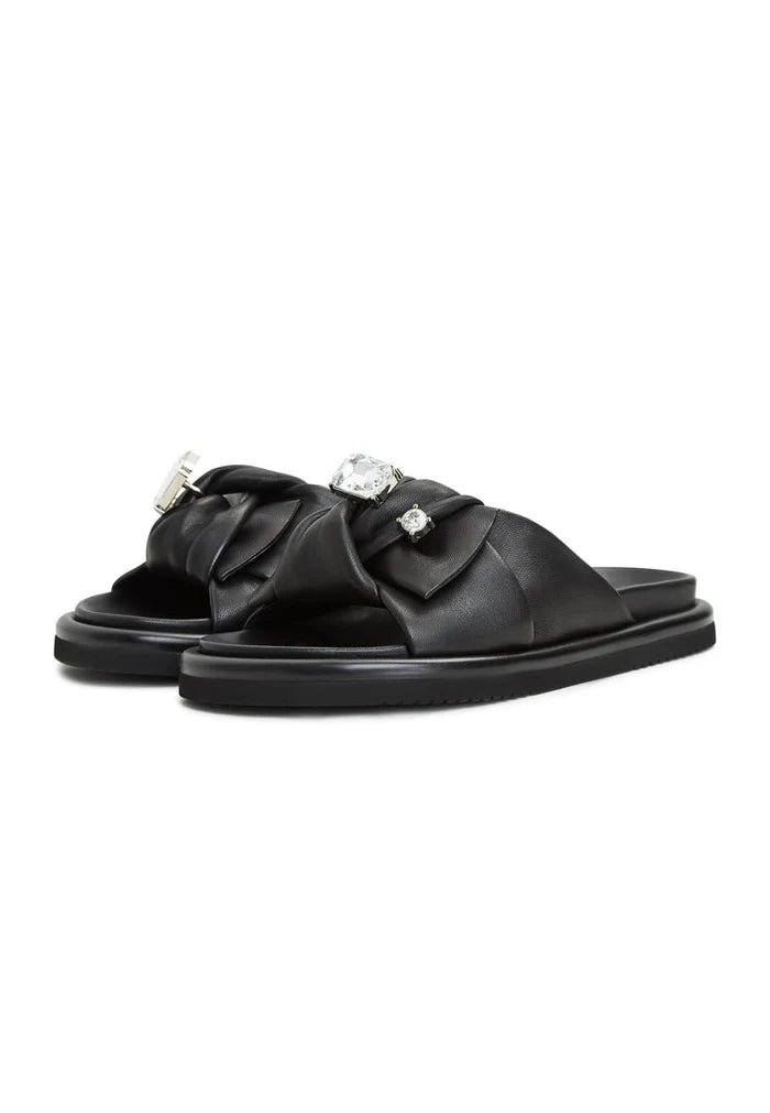 A chic pair of black platform slippers by Fernanda, perfect for trendy women's footbed sandals.