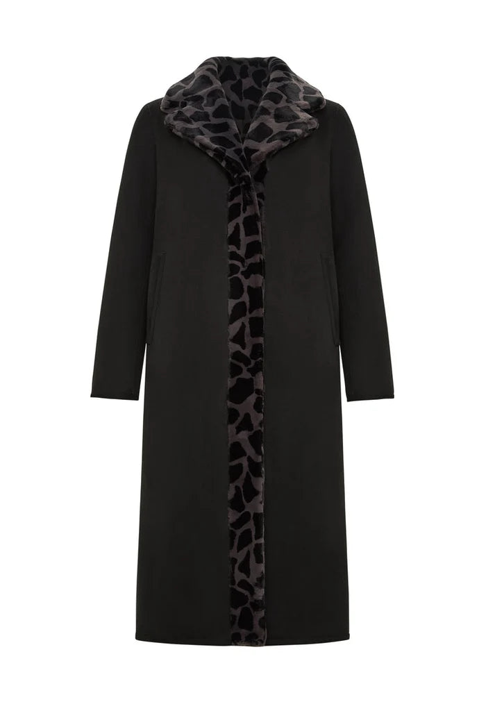A stylish reversible animal print coat with faux fur Pantera on one side and black fur on the other, making it a versatile and trendy piece of animal print outerwear for the fashion-forward winter wardrobe.