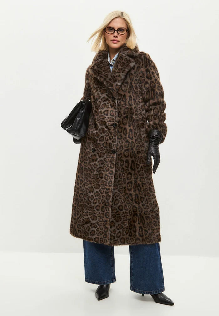 A trendy reversible faux shearling animal print coat, perfect for staying warm and stylish in the winter months.