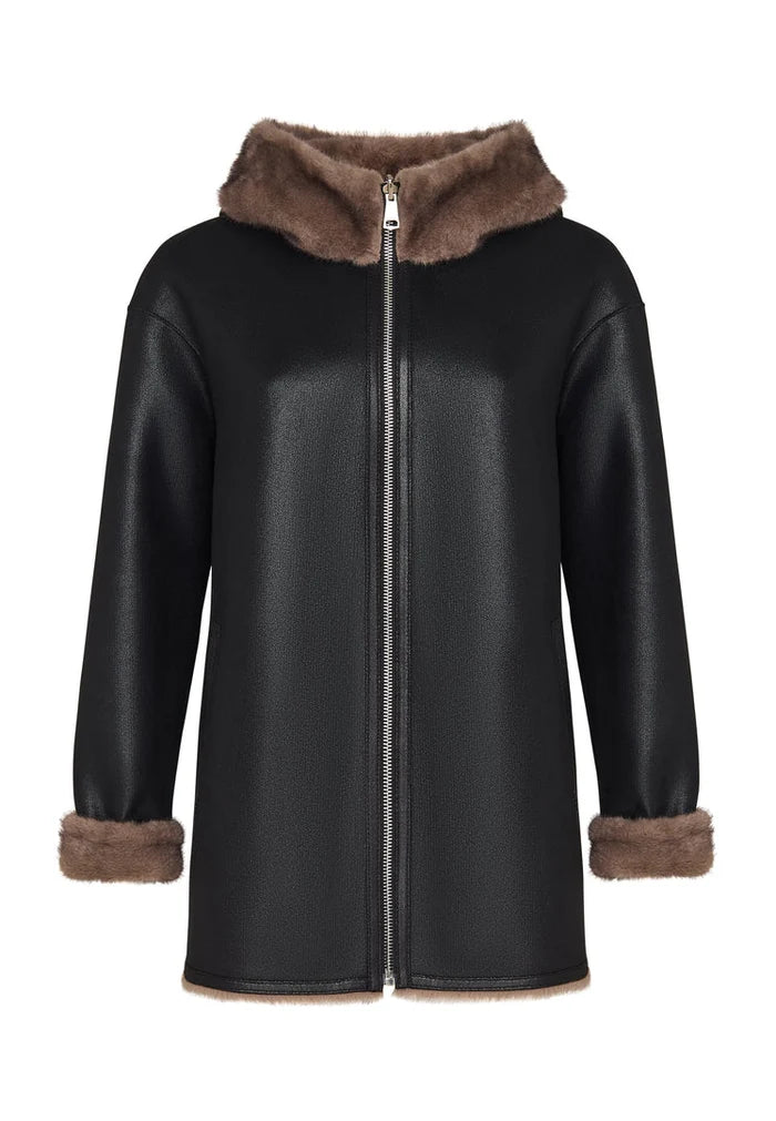A stylish reversible faux leather jacket with faux fur trim, perfect for a trendy and vegan-friendly outerwear option.