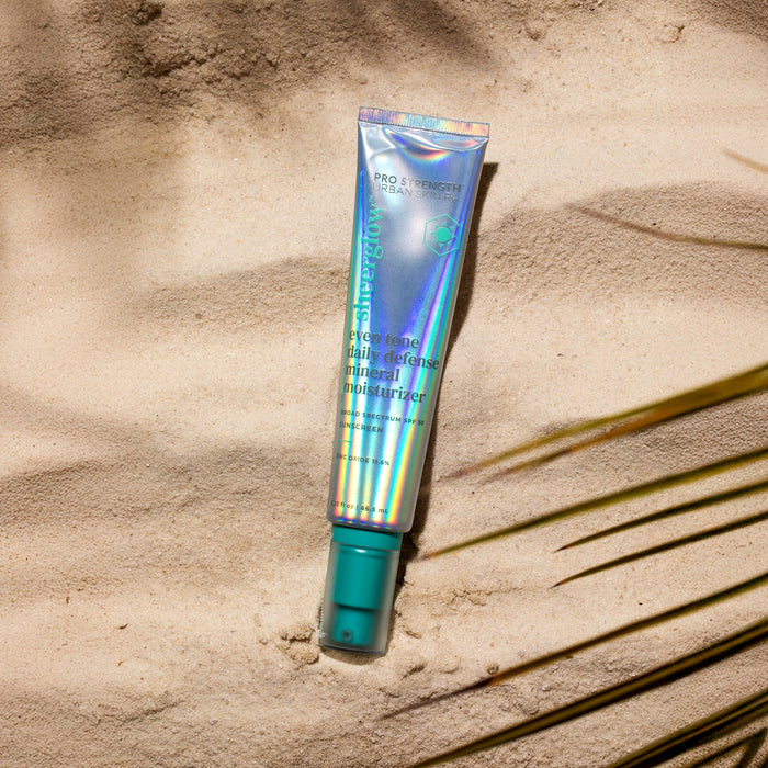 Tube of USRx Mineral Moisturizer against a light natural background