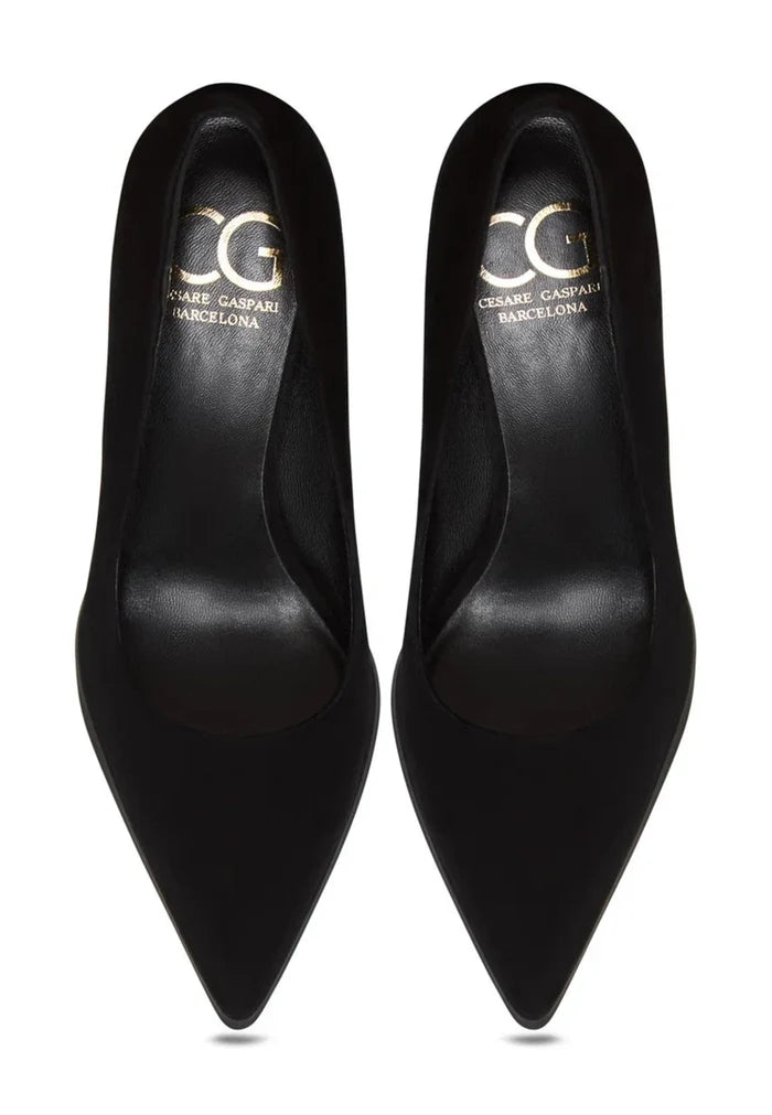 A pair of sleek black suede stilettos with a stunning skyline design -- the perfect statement suede heels for women's high fashion.