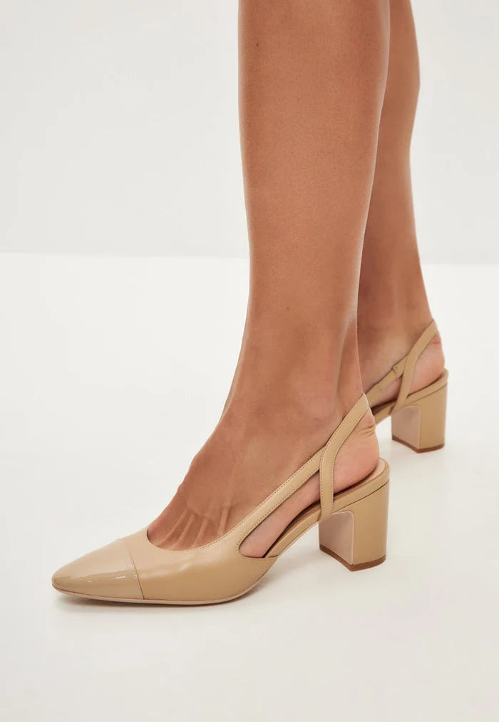 A stylish pair of beige slingback block heel pumps featuring delicate jasmine details, perfect for women's shoe collections.