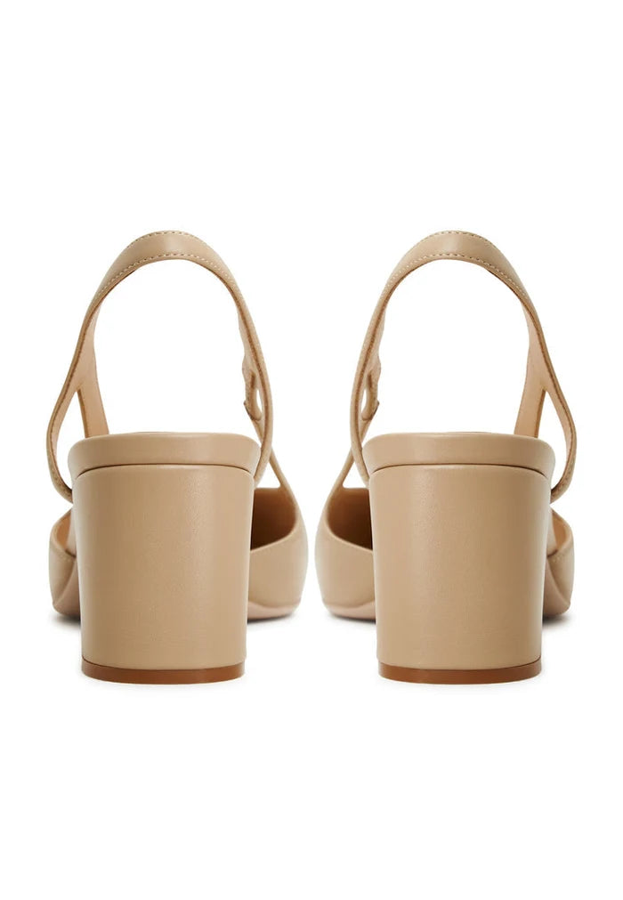 Beige suede pumps with slingback block heels, featuring intricate jasmine detailing, perfect for chic women's shoe collection.