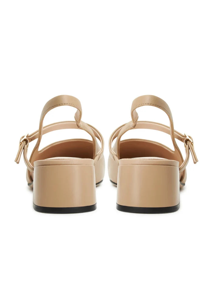 A stylish pair of Marisol beige slingback block heel pumps, perfect for any occasion.