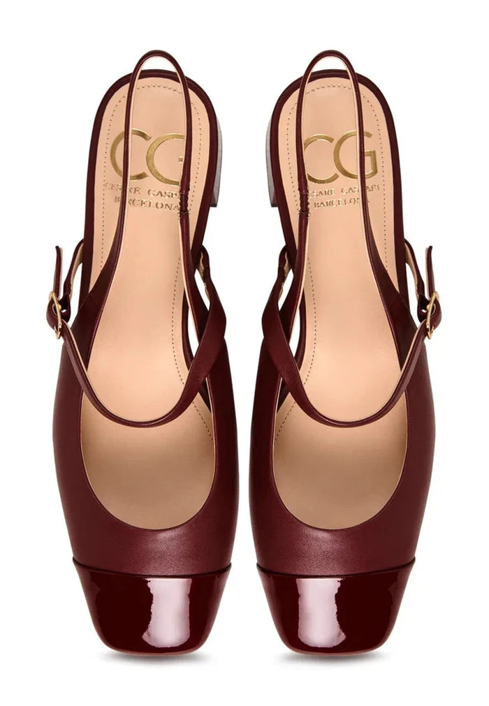 A stylish pair of women's block heel shoes in Bordeaux, featuring elegant slingback straps and a timeless design, perfect for any occasion.