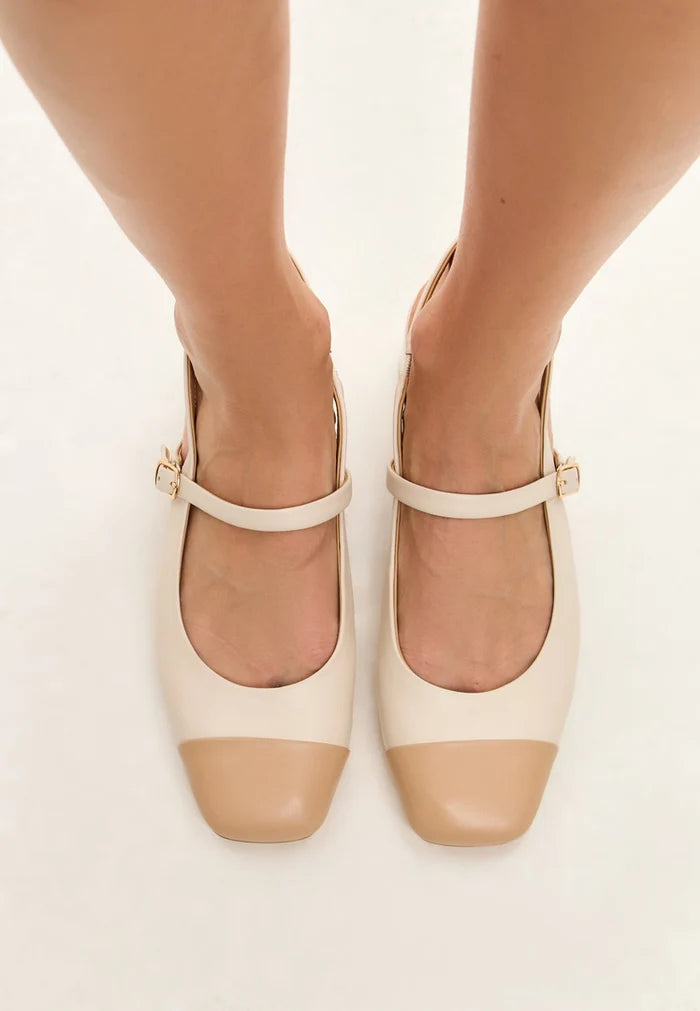 Pair of stylish light beige women's slingback block heels, the Pumps Marisol, a fashionable choice for any outfit with their on-trend design.