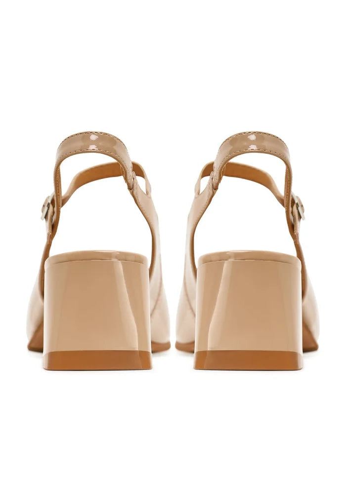 A fashionable pair of beige Nina slingback pumps, perfect for women looking for stylish dress shoes in the latest fashion footwear trends.