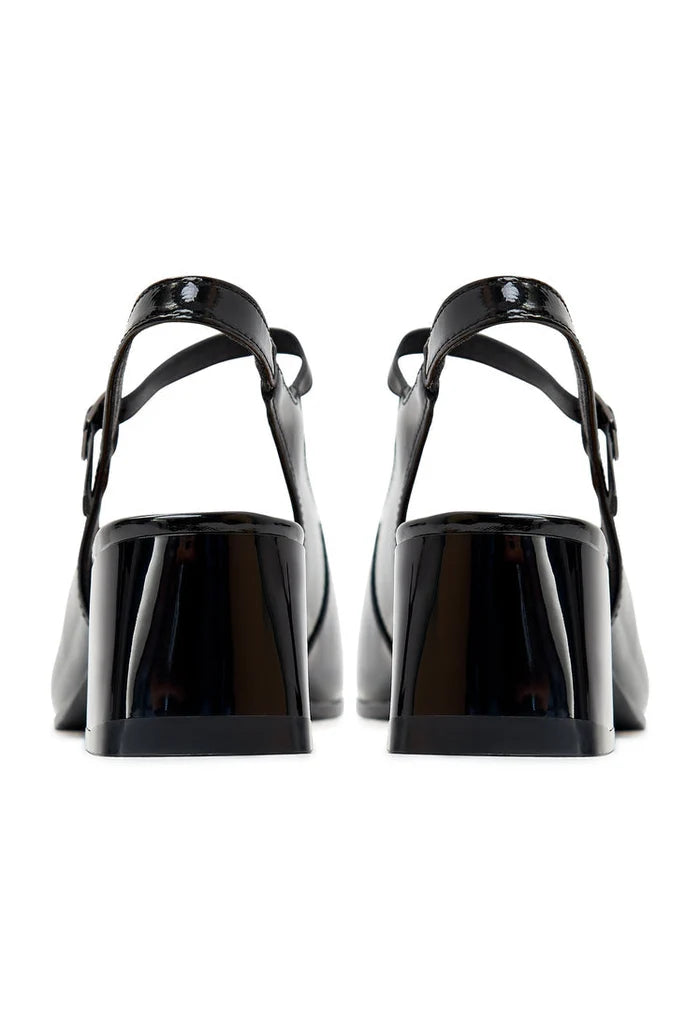 A close-up image of chic black slingback pumps by Nina, the perfect designer heels for sophisticated women's outfits.
