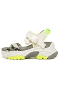 A trendy pair of white chunky strap sandals with a sporty design, perfect for adding a touch of style to your summer outfits.