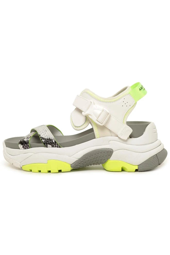 A trendy pair of white chunky strap sandals with a sporty design, perfect for adding a touch of style to your summer outfits.