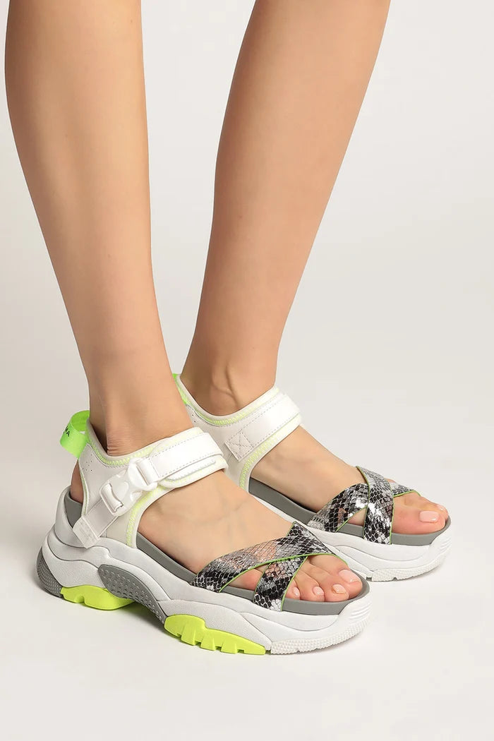 A close-up image of trendy sporty white strap sandals with chunky soles, perfect for a stylish and comfortable summer look.
