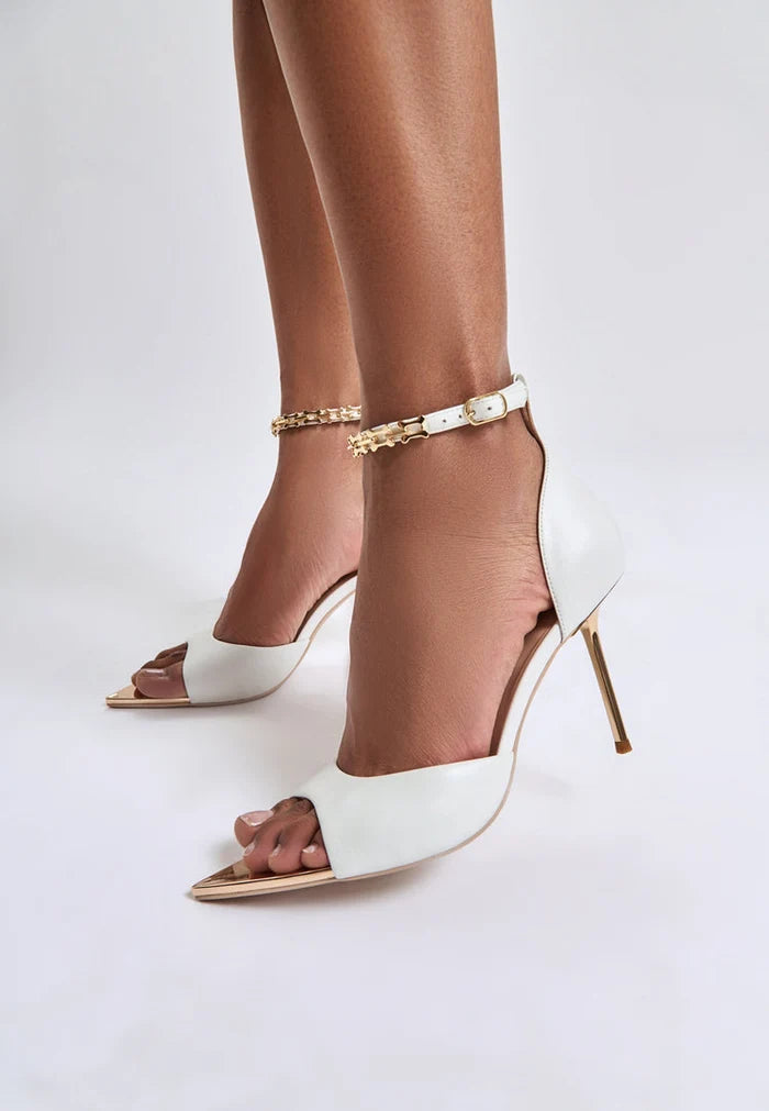 A sleek pair of white stiletto high-heeled sandals, perfect for any occasion. Buy trendy white stiletto sandals online now!
