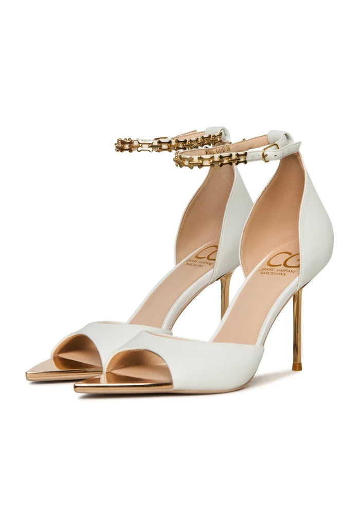 A stylish pair of white stiletto high-heeled sandals, perfect for any occasion. Buy these elegant white stiletto sandals online!