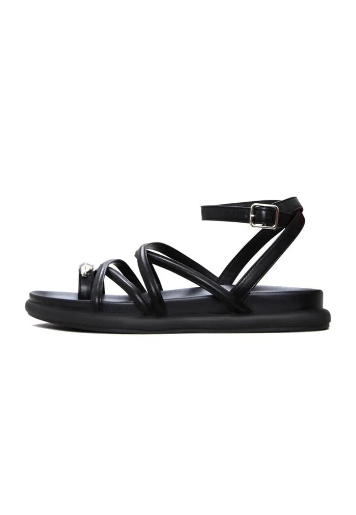 A close-up image of stylish women's leather strappy sandals, perfect for summer fashion and comfortable everyday wear.