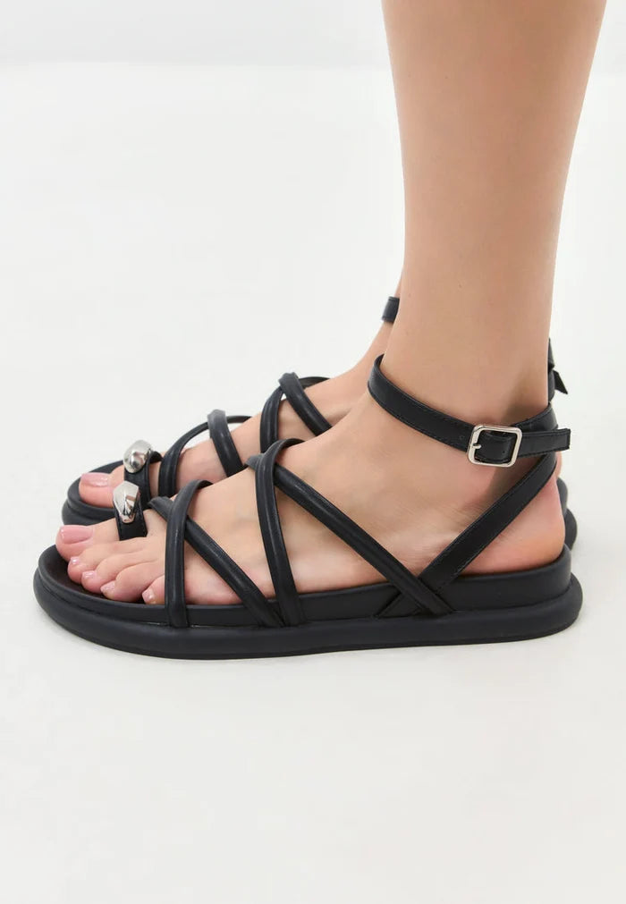 A stylish pair of women's fashion leather strappy sandals perfect for summer footwear.