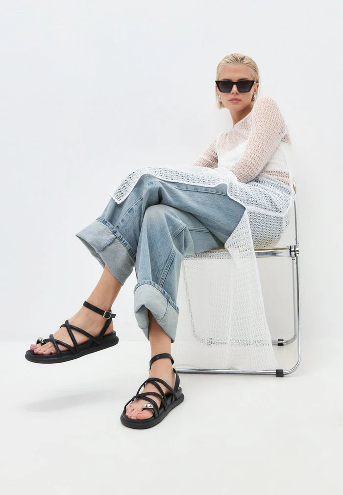 A fashionable pair of strappy leather sandals for women, perfect for summer footwear.