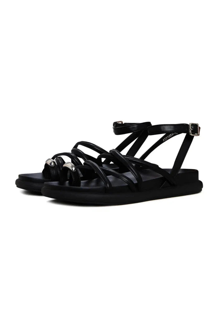 A close-up image of stylish women's leather strappy sandals, perfect for summer fashion and a trendy addition to any footwear collection.