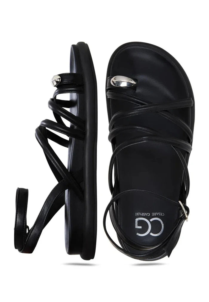 A trendy pair of women's leather strappy sandals, perfect for summer fashion and chic style.