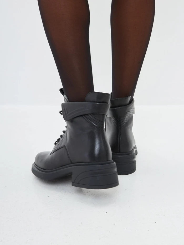 "A pair of stylish black ankle boots with trendy block heels, perfect for a fashionable look"