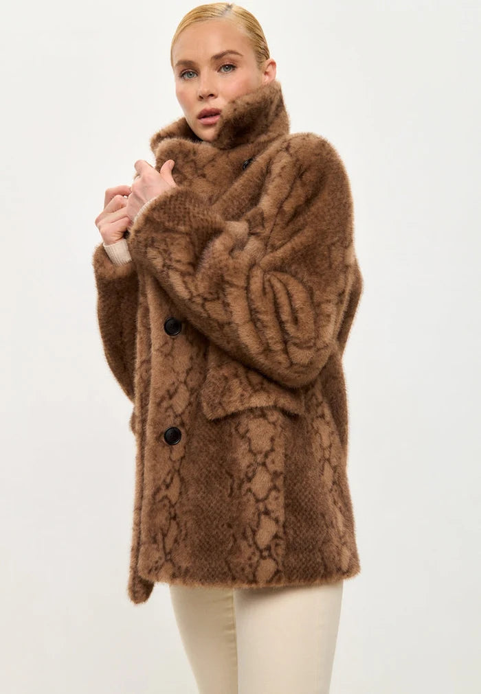A trendy Niuvis snake print faux fur coat in stylish brown, perfect for the fashion-forward individual looking for a trendy outerwear piece.