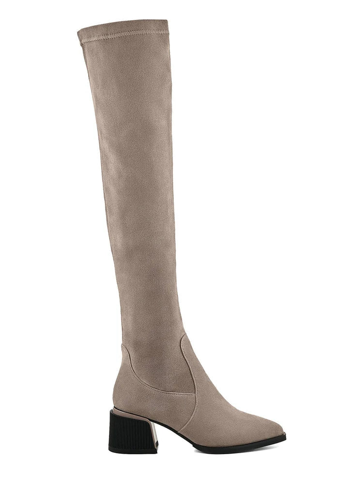 A fashionable pair of beige suede over-the-knee boots, the epitome of chic footwear fashion.