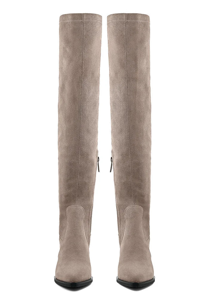 A pair of chic beige suede over-the-knee boots, the perfect fashion footwear staple.
